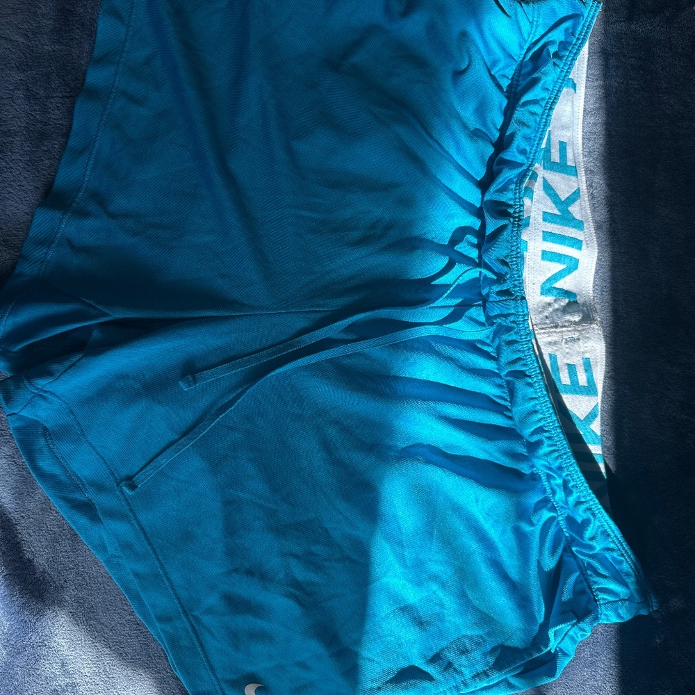 Blue Nike Dri Fit short cuts